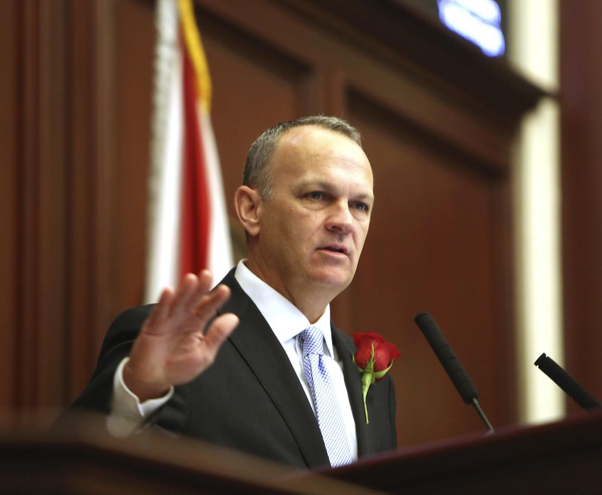 FILE- In this Nov. 22, 2016 file photo, Florida House Speaker Richard Corcoran, R- Land O' Lakes, addresses members of the Florida House in Tallahassee, Fla. Corcoran and Senate President Joe Negron are Republican lawyers. But the similarities start to drift from there. Negron calls himself boring and he's more the quiet, deliberative type. Corcoran likes listening to music at top volume and his approach to leadership reflects that. (Scott Keeler /Tampa Bay Times via AP, File)