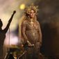 FILE - This Feb. 12, 2017, file photo, shows Beyonce performing at the 59th annual Grammy Awards in Los Angeles. Beyonce shared photos of her growing baby bump on her website Monday, March 6, 2017. She and husband Jay Z are expecting twins. (Photo by Matt Sayles/Invision/AP, File)