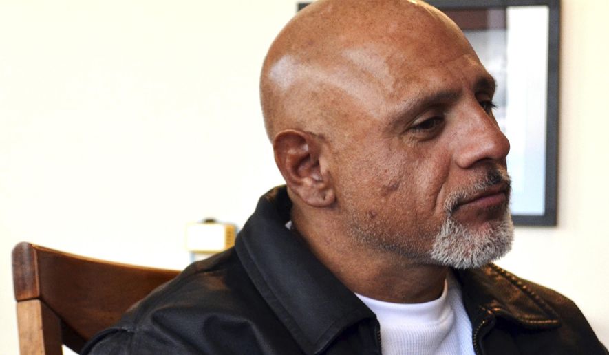 In this Wednesday, Jan. 25, 2016 photo, George Abila, who won a nearly $2 million lawsuit against New Mexico's Eddy County over his treatment while held in solitary confinement, sits in his attorney's office in Albuquerque, N.M. Former jail inmates have won more than $20 million in judgments in recent years against New Mexico counties over their treatment while held in solitary confinement. With more cases pending, state lawmakers are debating a proposal that would ban solitary confinement for juveniles, pregnant women and inmates with mental illness. (AP Photo/Mary Hudetz)