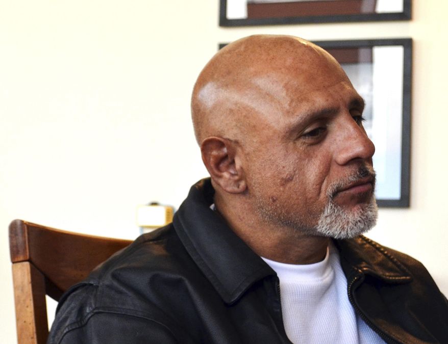 In this Wednesday, Jan. 25, 2016 photo, George Abila, who won a nearly $2 million lawsuit against New Mexico's Eddy County over his treatment while held in solitary confinement, sits in his attorney's office in Albuquerque, N.M. Former jail inmates have won more than $20 million in judgments in recent years against New Mexico counties over their treatment while held in solitary confinement. With more cases pending, state lawmakers are debating a proposal that would ban solitary confinement for juveniles, pregnant women and inmates with mental illness. (AP Photo/Mary Hudetz)