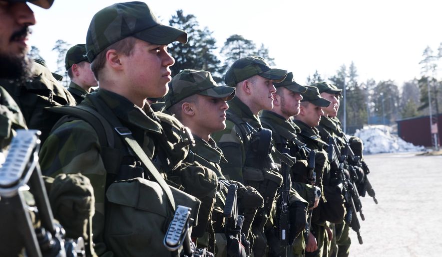 Swedish military recruits are shown standing at attention in this file photo from March 2017. (Associated Press)  **FILE**
