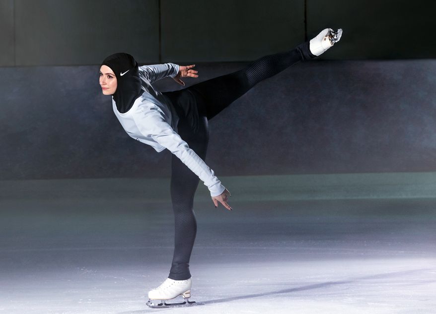 In this undated image provided by Nike, figure skater Zahra Lari model wears Nike's new hijab for Muslim female athletes. The pull-on hijab is made of light, stretchy fabric that includes tiny holes for breathability and an elongated back so it will not come untucked. It will come in three colors: black, vast grey and obsidian. Beaverton-based Nike says the hijab will be available for sale next year. (Nike via AP)
