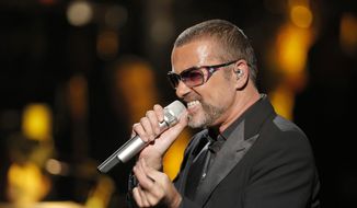 British singer George Michael sings in concert to raise money for AIDS charity Sidaction, in Paris, France, in this Sept. 9, 2012, file photo. A British coroner said Tuesday, March 7, 2017, that Michael died of natural causes as the result of heart disease and a fatty liver. (AP Photo/Francois Mori, File)