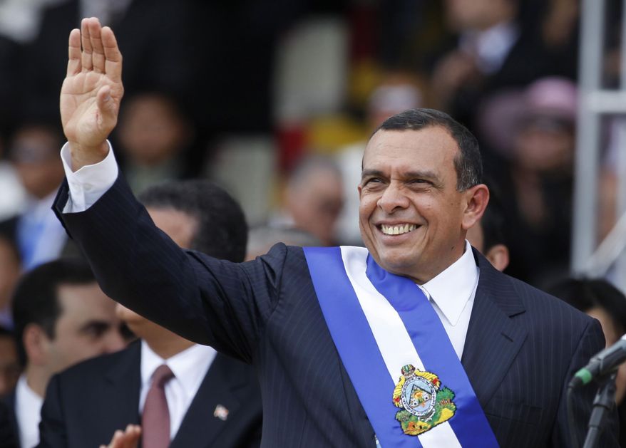 FILE - In this Jan. 27, 2010 file photo, Honduras' President Porfirio Lobo, waves during his presidential inauguration ceremony in Tegucigalpa, Honduras. A man who led a violent Honduran drug trafficking organization has told a New York court on Monday, March 6, 2017, that he bribed the former president and his son to protect his drug trafficking operations and to secure government contracts to help him launder money. The alleged bribes occurred from 2009-2013. (AP Photo/Eduardo Verdugo, File)