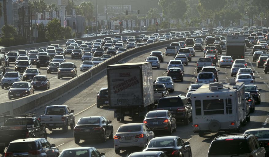 FILE - This Sept. 9, 2016 file photo shows rush hour traffic moving along the Hollywood Freeway in Los Angeles. The city long known for its sprawl and glacial traffic is fighting over what it should become in the future. An election Tuesday, March 7, 2017, features a proposal intended to restrict taller, denser development in the city of nearly 4 million, a chapter in a long-running battle over density and what the city should look like in the years to come. (AP Photo/Richard Vogel, File)