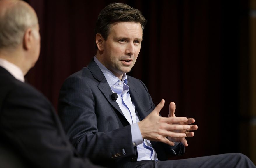 Former Obama White House press secretary Josh Earnest, right, participates in a forum called "The Press & the Presidency," as Harvard professor and former presidential advisor David Gergen, left, looks on, Tuesday, March 7, 2017, at the John F. Kennedy School of Government on the campus of Harvard University, in Cambridge, Mass. Earnest has accused President Donald Trump of using wiretapping allegations as a distraction. (AP Photo/Steven Senne)