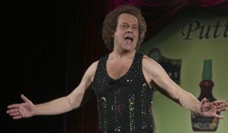 Richard Simmons speaks to the audience before the start of a summer salad fashion show at Grand Central Terminal in New York, in this June 2, 2006, file photo. Simmons publicist Tom Estey denied a claim by Simmons&#39; former former masseuse and friend Mauro Oliveira that Simmons is being controlled by his housekeeper. Estey tells People magazine for an article published March 6, 2017, that Simmons has made a choice “to live a more private life.” (AP Photo/Tina Fineberg, File)