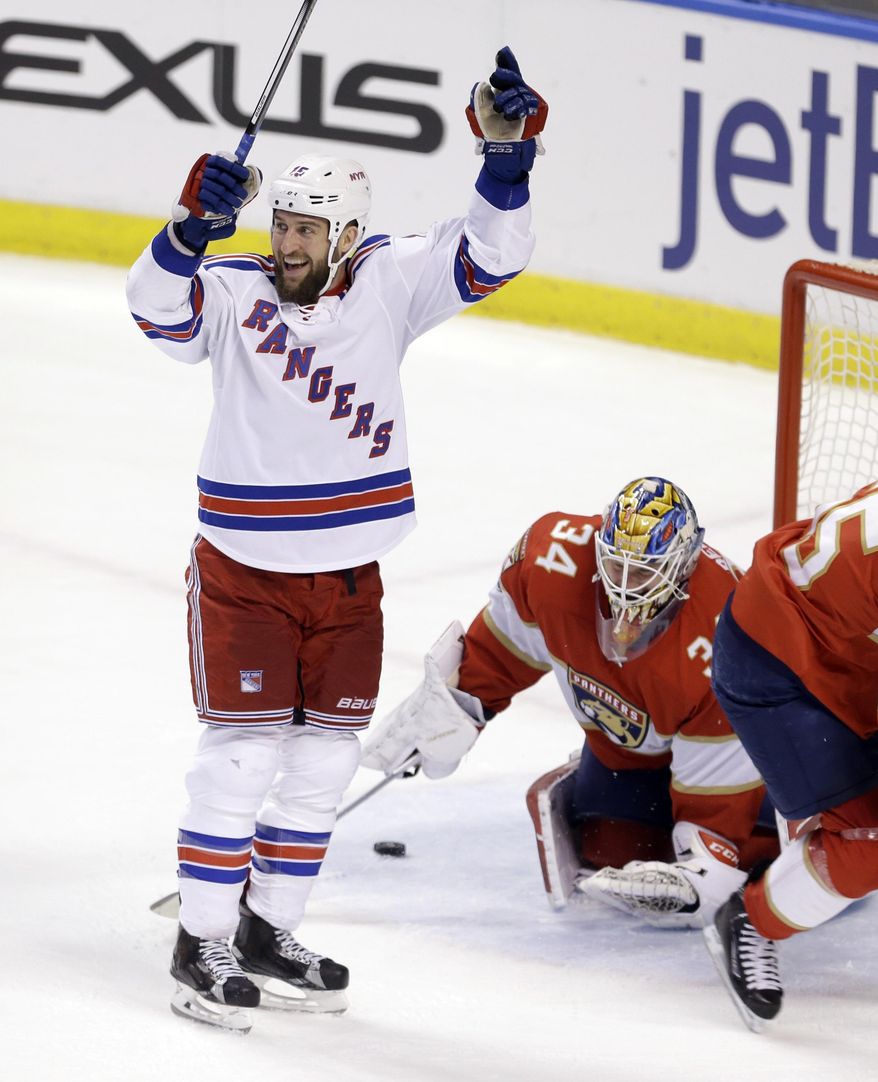 New York Rangers left wing Tanner Glass (15) celebrates after scoring against Florida Panthers goalie James Reimer (34) in the first period of an NHL hockey game, Tuesday, March 7, 2017, in Sunrise, Fla. (AP Photo/Alan Diaz)
