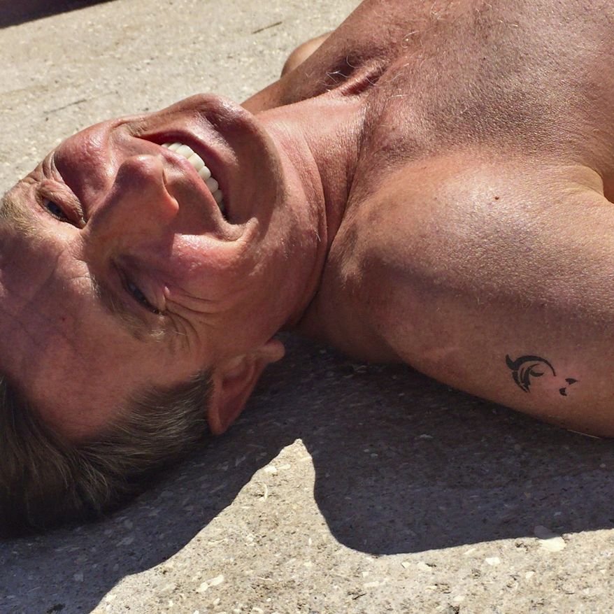 In this undated photo provided by the Office of the Slovenia&#x27;s president and used on president&#x27;s Instagram, Slovenia&#x27;s president Borut Pahor, enjoys sunbathing on a beach in Pacug, Slovenia. Donald Trump may rule Twitter, but he&#x27;s no match for his Slovenian counterpart on Instagram as Slovenia&#x27;s president Borut Pahor has been actively using social media to get his message across since 2012. (Petra Arsic/Office of the Slovenia&#x27;s President via AP)