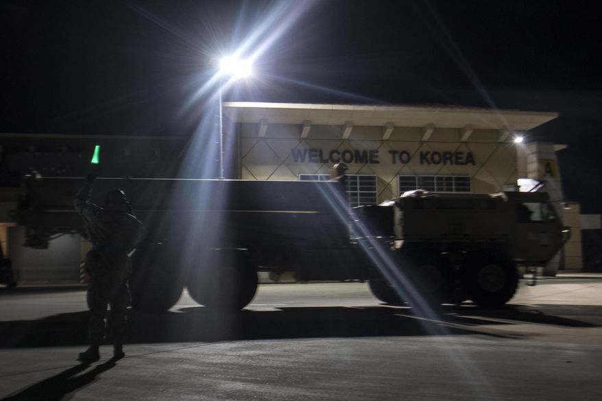 In this photo provided by U.S. Forces Korea, a truck carrying parts of U.S. missile launchers and other equipment needed to set up the Terminal High Altitude Area Defense (THAAD) missile defense system arrive at Osan air base in Pyeongtaek, South Korea, Monday, March 6, 2017. The US military has begun moving equipment for the controversial missile defense system to ally South Korea. The announcement Tuesday by the U.S. military comes a day after North Korea test-launched four ballistic missiles into the ocean near Japan. (U.S. Force Korea via AP)