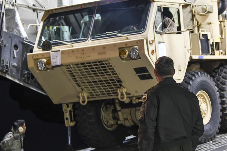 In this photo provided by U.S. Forces Korea, a truck carrying parts of U.S. missile launchers and other equipment needed to set up the Terminal High Altitude Area Defense (THAAD) missile defense system arrive at the Osan base, South Korea, Monday, March 6, 2017. The U.S. military has begun moving equipment for the controversial missile defense system to ally South Korea. The announcement Tuesday by the U.S. military comes a day after North Korea test-launched four ballistic missiles into the ocean near Japan. (U.S. Force Korea via AP)