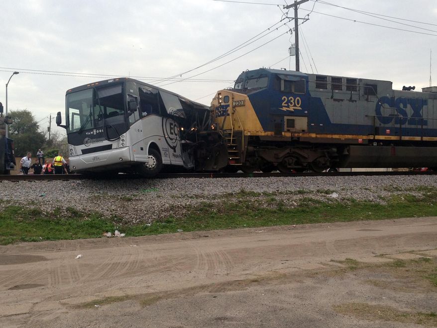 A freight train smashed into a charter bus in Biloxi, Mississippi, on Tuesday, March 7, 2017, pushing the bus 300 feet down the tracks authorities said. Authorities worked for more than an hour to remove passengers, Biloxi Fire Chief Joe Boney said, taking the injured people to area hospitals and cutting through the bus’s mangled body to extract the final two people. (AP Photo/Kevin McGill)
