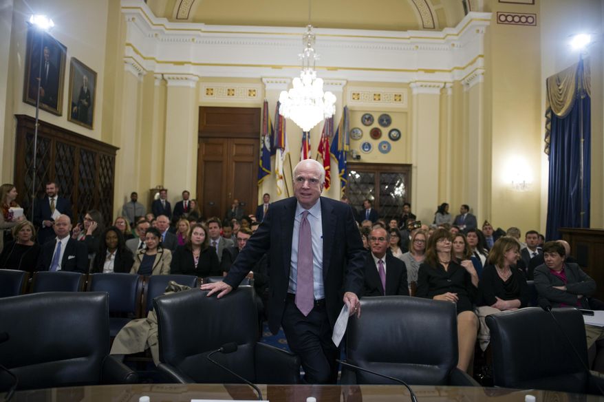 Sen. John McCain, R-Az., takes a seat at the witness table to address the House Veterans' Affairs Committee's hearing on the Veterans Affairs community care program, on Captiol Hill in Washington, Tuesday, March 7, 2017. (AP Photo/Cliff Owen)