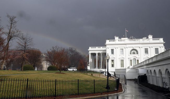 FILE - In this Saturday, Feb. 25, 2017, file photo, a rainbow is seen next to the White House as a cold front passes through the area in Washington. The White House is staffing up its team of lawyers as it prepares for a complicated mix of ethics issues and policy fights ahead. (AP Photo/Alex Brandon, File)
