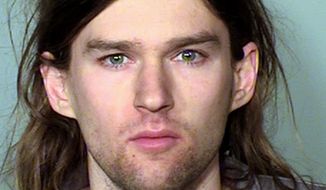 This photo provided by the Ramsay County Sheriff&#39;s Offfice in St. Paul, Minn., shows Linwood Kaine, the youngest son of U.S. Sen. Tim Kaine. Kaine was one of several people arrested Saturday, March 4, 2017, during a counter protest at a rally in support of President Donald Trump at the State Capitol rotunda in St. Paul. (Ramsay County Sheriff&#39;s Office via AP)