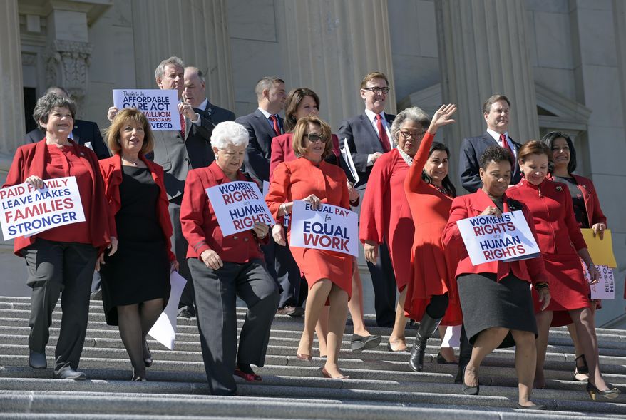 House Minority Leader Nancy Pelosi of Calif. center, and other Democratic Congressional members, walk down the steps on Capitol Hill in Washington, Wednesday, March 8, 2017, for an event to honor International Women's Day. (AP Photo/Susan Walsh)