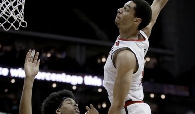 Texas Tech&#x27;s Zach Smith (11) goes to the basket as Texas&#x27; Jarrett Allen (31) defends during the first half of an NCAA college basketball game in the Big 12 tournament Wednesday, March 8, 2017, in Kansas City, Mo. (AP Photo/Charlie Riedel)