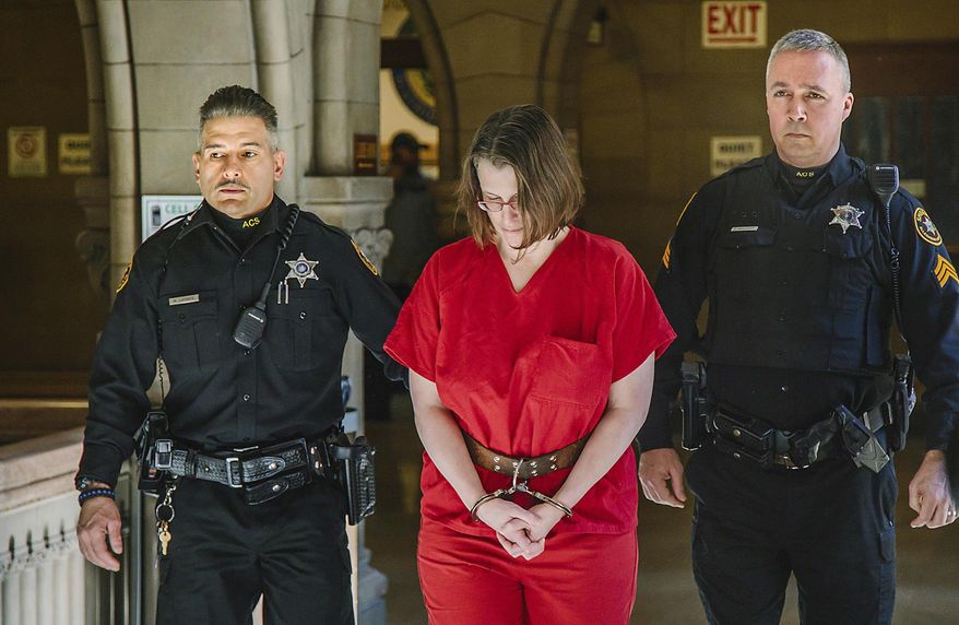 Laurel Schlemmer, who is accused of drowning two of her sons, is escorted to the courtroom at the Allegheny County Courthouse to appear for her nonjury trial before Judge Jeffrey A. Manning, Wednesday, March 8, 2017. Ms. Schlemmer is accused of drowning her sons Luke, 3, and Daniel, 6, in the bathtub of their McCandless, Pa., home on April 1, 2014. (Andrew Rush/Pittsburgh Post-Gazette via AP)