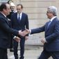 France&#x27;s President Francois Hollande, left, welcomes Armenia&#x27;s President Serge Sarkissian at the Elysee Palace, Wednesday, March 8, 2017. (AP Photo/Michel Euler)