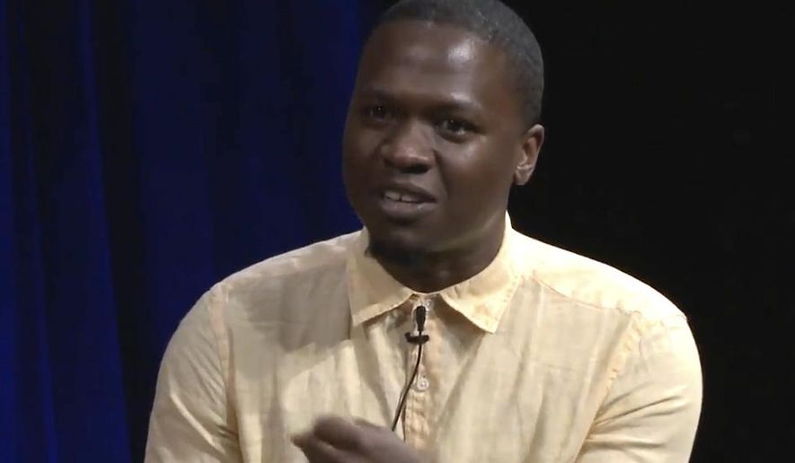 In this undated image taken from BRIC TV video, journalist Juan Thompson speaks while appearing on a panel in New York, which was discussing racism. Thompson, who is accused of making bomb threats to several Jewish centers across the country, faces a hearing in federal court in Missouri on Wednesday, March 8, 2017, to determine whether he can be released on bail. (BRIC TV via AP)