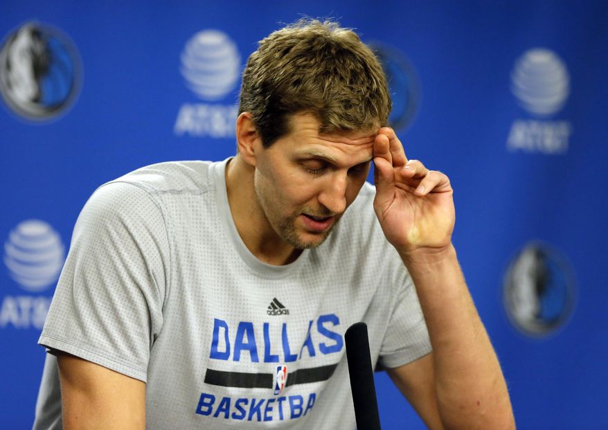 Dallas Mavericks&#39; Dirk Nowitzki of Germany pauses as he responds to a question during a news conference after their NBA basketball game against the Los Angeles Lakers in Dallas, Tuesday, March 7, 2017. Nowitzki surpassed the 30,000 career points mark in the 122-111 Mavericks win. (AP Photo/Tony Gutierrez)