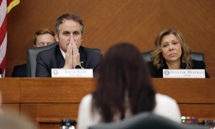 Texas Sen. Bryan Hughes, R-Mineola, left, and Sen. Joan Huffman, R-Houston, right, listen to testimony as the Senate State Affairs Committee begins debate Senate Bill 6 at the Texas Capitol, Tuesday, March 7, 2017, in Austin, Texas. The the transgender "bathroom bill" would require people to use public bathrooms and restrooms that correspond with the sex on their birth certificate. (AP Photo/Eric Gay)