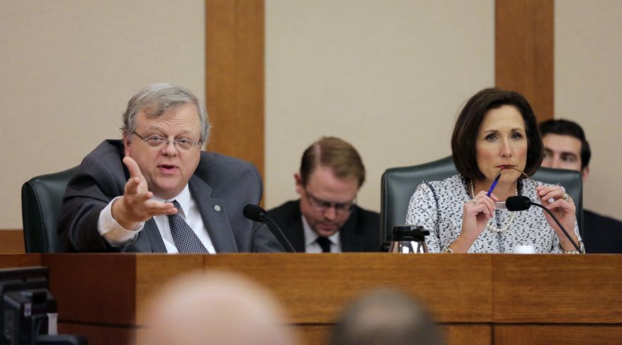 Texas Sen. Paul Bettencourt, R-Houston, left, and Sen. Lois Kolkhorst, R-Brenham, take part as the Senate State Affairs Committee begins talks about Senate Bill 6 at the Texas Capitol, Tuesday, March 7, 2017, in Austin, Texas. The the transgender "bathroom bill" would require people to use public bathrooms and restrooms that correspond with the sex on their birth certificate. (AP Photo/Eric Gay)