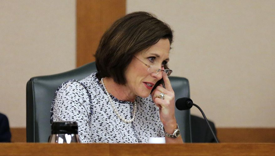 Texas Sen. Lois Kolkhorst, R-Brenham, fights back tears as the Senate State Affairs Committee begin talks about Senate Bill 6 at the Texas Capitol, Tuesday, March 7, 2017, in Austin, Texas. The the transgender "bathroom bill" would require people to use public bathrooms and restrooms that correspond with the sex on their birth certificate. (AP Photo/Eric Gay)