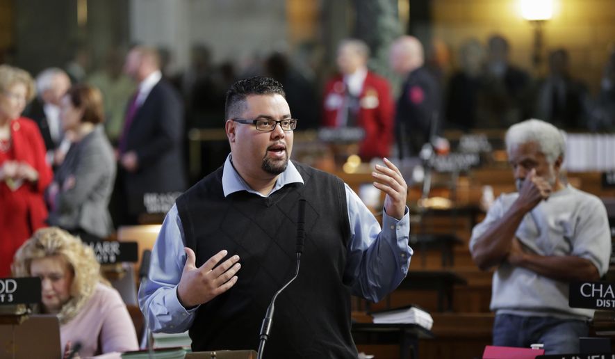 Sen. Justin Wayne of Omaha, a criminal defense attorney who has represented drug offenders, speaks in Lincoln, Neb., Wednesday, March 8, 2017, during a debate on a compromise bill that would eliminate mandatory minimum sentences for drug offenders. Nebraska lawmakers have reached a compromise that would eliminate mandatory minimum sentences for cocaine, heroin and meth dealers. Senators voted 25-22 to advance the measure. (AP Photo/Nati Harnik)
