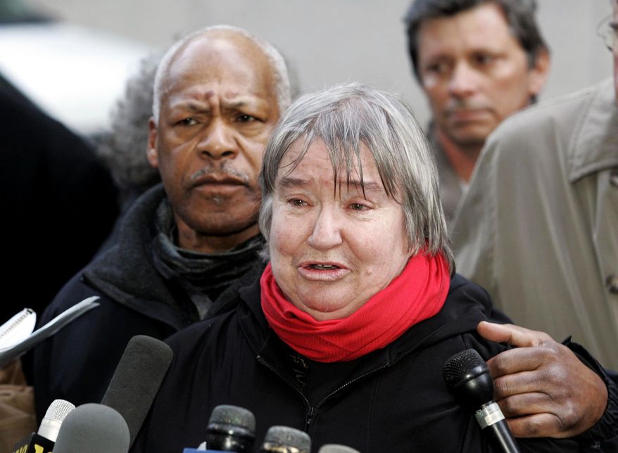 FILE - In this Feb. 10, 2005 file photo, Lynne Stewart cries as she speaks to the press with her husband Ralph Pointer, left, outside Federal Court in New York after Stewart's compassionate release from prison. The outspoken New York civil rights lawyer who represented clients ranging from small-time criminals to radicals and was released early from prison because she was expected to die of cancer has died. Her husband, Poynter, said Stewart died Tuesday, March 7, 2017, in the Brooklyn home where she lived after receiving a "compassionate release" from prison in January 2014. (AP Photo/David Karp, File)