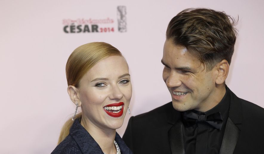 In this Feb. 28, 2014, file photo, U.S. actress Scarlett Johansson, left, and her partner Romain Dauriac arrive at the 39th French Cesar Awards Ceremony, in Paris. Dauriac&#39;s lawyer confirmed to The Associated Press that Johansson filed for divorce from Dauriac on March 7, 2017, in New York,. (AP Photo/Lionel Cironneau, File)