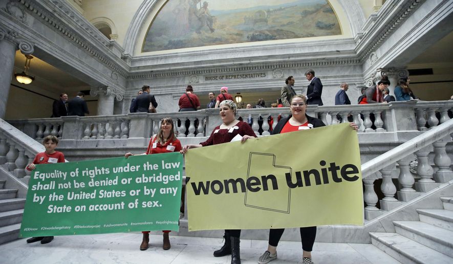 Women protests outside the House of Representatives at the Utah state capitol for a Day Without a Woman protest to remind legislators they're closely watching how they handle women's issues Wednesday, March 8, 2017, in Salt Lake City. (AP Photo/Rick Bowmer)