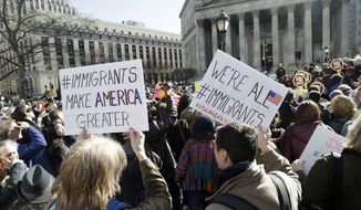 In this file photo, people hold anti-deportation signs during a rally, Thursday, March 9, 2017, in New York. The rally was held in support of Ravi Ragbir, leader of the New Sanctuary Coalition, and an immigrant from Trinidad, who may face deportation. (AP Photo/Mark Lennihan)