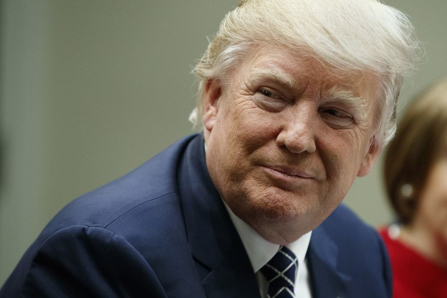 President Donald Trump listens during a meeting with leaders from small community banks, Thursday, March 9, 2017, in the Roosevelt Room of the White House in Washington. (AP Photo/Evan Vucci) ** FILE **