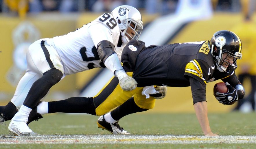 FILE - In this Nov. 8, 2015, file photo, Pittsburgh Steelers quarterback Ben Roethlisberger, right, is injured as he is tackled by Oakland Raiders outside linebacker Aldon Smith in the fourth quarter of an NFL football game in Pittsburgh. Authorities say the suspended Raiders player was detained in San Francisco on Thursday morning, March 9, 2017. after an SUV he was a passenger in collided with an undercover San Francisco police car, injuring two officers. Smith was detained for public intoxication. (AP Photo/Don Wright, File)
