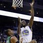 Golden State Warriors&#39; Draymond Green, right, shoots over Boston Celtics&#39; Al Horford (42) during the first half of an NBA basketball game Wednesday, March 8, 2017, in Oakland, Calif. (AP Photo/Ben Margot)