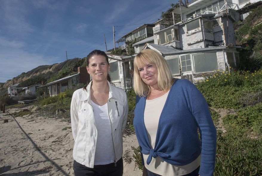 Crystal Cove Alliance President/CEO Alix Hobbs, left, and Executive Director Laura Davick, right, are working on plans for phase two of Crystal Cove Cottages' next chapter which involves refurbishing a row of cottages on the sand. More than a dozen dilapidated cottages at an oceanfront Southern California park will be renovated and made available for overnight rentals under a plan approved by the state Coastal Commission. Commissioners on Wednesday, March 8, 2017, unanimously approved a $30 million development permit to rebuild the wood cottages at Crystal Cove State Park. (Ana Venegas/The Orange County Register via AP)