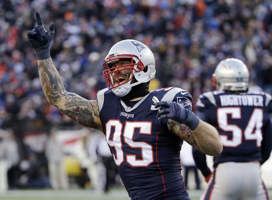 FILE - In this Dec. 4, 2016, file photo, New England Patriots defensive end Chris Long (95) celebrates after sacking Los Angeles Rams quarterback Jared Goff during an NFL football game, Sunday, Dec. 4, 2016, in Foxborough, Mass. Long joined his dad, former Oakland star Howie Long, as a Super Bowl winner with New England. He wasn’t a standout on defense like his dad, but his experience made a difference as a high-value free agent. (AP Photo/Elise Amendola, File)