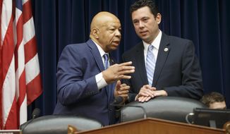 FILE - In this July 7, 2016 file photo, House Oversight and Government Reform Committee Chairman Rep. Jason Chaffetz, R-Utah, right, confers with the committee&#39;s ranking member Rep. Elijah Cummings, D-Md. on Capitol Hill in Washington. Congressional investigators are demanding documents and contacting witnesses in a wide-ranging probe of the Defense Department’s troubled anti-propaganda efforts against the Islamic State.  (AP Photo/J. Scott Applewhite, File)