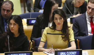 Human rights lawyer Amal Clooney, right, and her client Nadia Murad, left, a human rights activist and Yazidi genocide survivor, listen during a United Nations human rights meeting called &amp;quot;The Fight against Impunity for Atrocities: Bringing Da&#39;esh [ISIS] to Justice,&amp;quot; Thursday, March 9, 2017 at U.N. headquarters. (AP Photo/Bebeto Matthews)