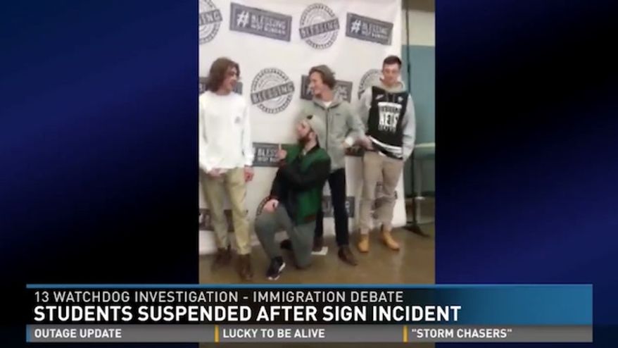 Four Michigan high school students were suspended after demonstrating against a pro-immigration banner on campus by holding up their own handmade "Trump" and "Build the Wall" signs, which eventually led to a heated, yet nonviolent, argument among students. (WZZM)