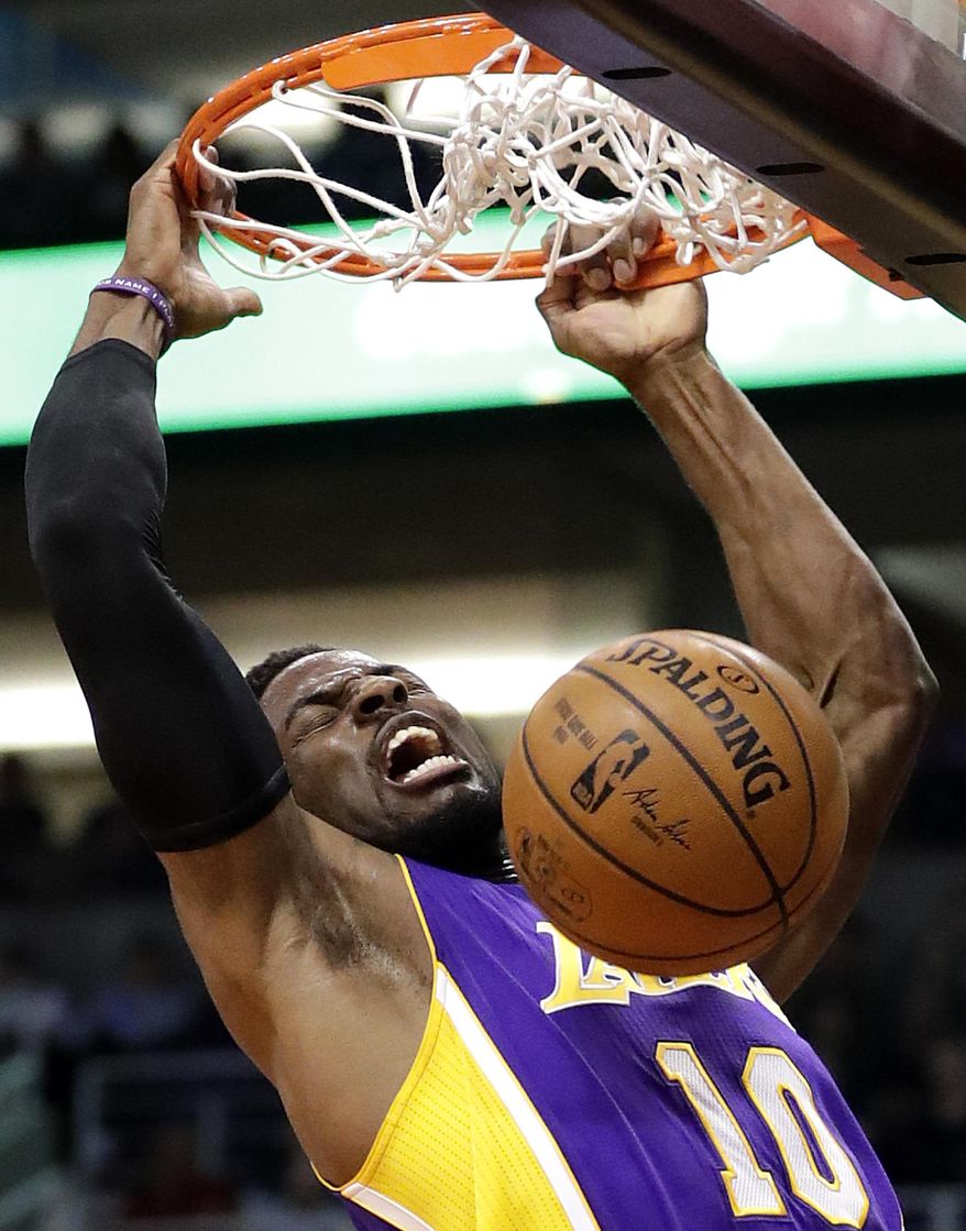 Los Angeles Lakers guard David Nwaba dunks against the Phoenix Suns during the first half of an NBA basketball game, Thursday, March 9, 2017, in Phoenix. (AP Photo/Matt York)