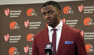 FILE - In this Jan. 1, 2017, file photo, Cleveland Browns quarterback Robert Griffin III is shown during a press conference following an NFL football game against the Pittsburgh Steelers, in Pittsburgh. A person familiar with the decision says the Cleveland Browns are releasing quarterback Robert Griffin III after one injury-marred season. Griffin is being let go one day before he would have been due a $750,000 roster bonus, said the person who spoke Friday, March 10, 2017,  to the Associated Press on condition of anonymity because the team has not announced the move. (AP Photo/Don Wright, File)
