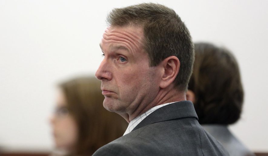 FILE - In this March 6, 2017 file photo, Curtis Lovelace looks over at prosecutors during his first-degree murder trial at the Sangamon County Courthouse in Springfield, Ill. Lovelace, a former Adams County assistant state's attorney, was acquitted in the 2006 death of his first wife, Cory Lovelace in his second murder trial Friday, March, 10, 2016 in Springfield, Ill. His first trial ended with a deadlocked jury. The jury of six men and six women deliberated for a little over two hours before determining Lovelace did not kill his wife. (Phil Carlson/The Quincy Herald-Whig via AP, Pool)
