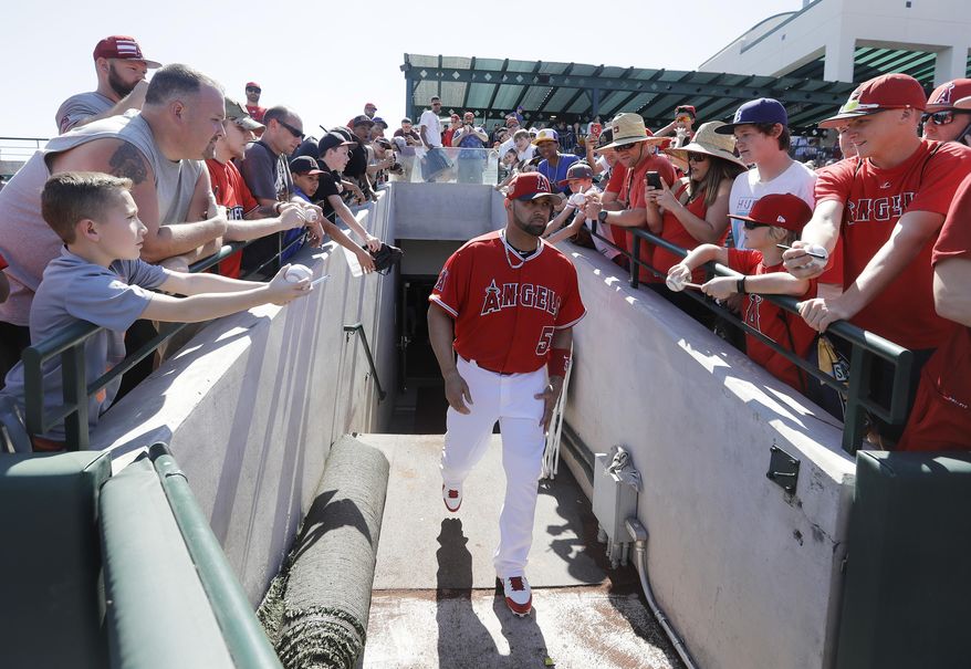 Los Angeles Angels&#x27; Albert Pujols walks to the field before a spring training baseball game against the San Diego Padres, Friday, March 10, 2017, in Tempe, Ariz. (AP Photo/Darron Cummings)