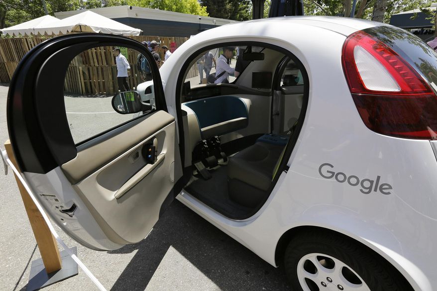 FILE - This May 18, 2016, file photo shows a Google self-driving car on display at Google's I/O conference in Mountain View, Calif. Cars with no steering wheel, no pedals and nobody at all inside could be driving themselves on California roads by the end of 2017, under proposed new rules that would give a powerful boost to the technology from the nation's most populous state. (AP Photo/Eric Risberg, File)