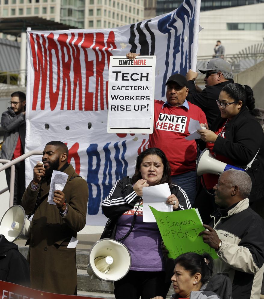 ADVANCE FOR USE MONDAY, MARCH 13, 2017 AND THEREAFTER-In this Monday, Feb. 13, 2017 photo, tech workers protest Trump administration policies in San Francisco. In the wake of the 2016 election, old-school, anti-capitalist activists and new-school, free-enterprise techies in the city are pushing aside their differences to take on a common foe. (AP Photo/Ben Margot)