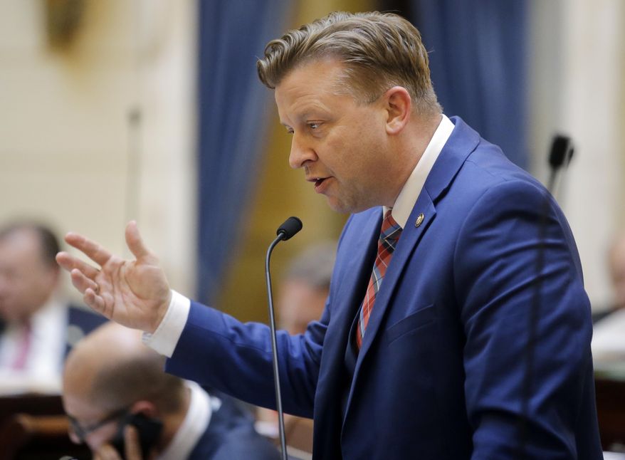 Sen. Todd Weiler, R-Woods Cross, speaks to the Senate at the Utah State Capitol Thursday, March 9, 2017, in Salt Lake City. Two proposals by Weiler, that seek to tighten oversight of pornography have easily made it through the Legislature. One proposal would allow pornography distributors to be sued if a minor exposed to the material says they were hurt by it, while the other would require public libraries to install blockers on their wireless networks to prevent people from viewing obscene content in libraries. (AP Photo/Rick Bowmer)