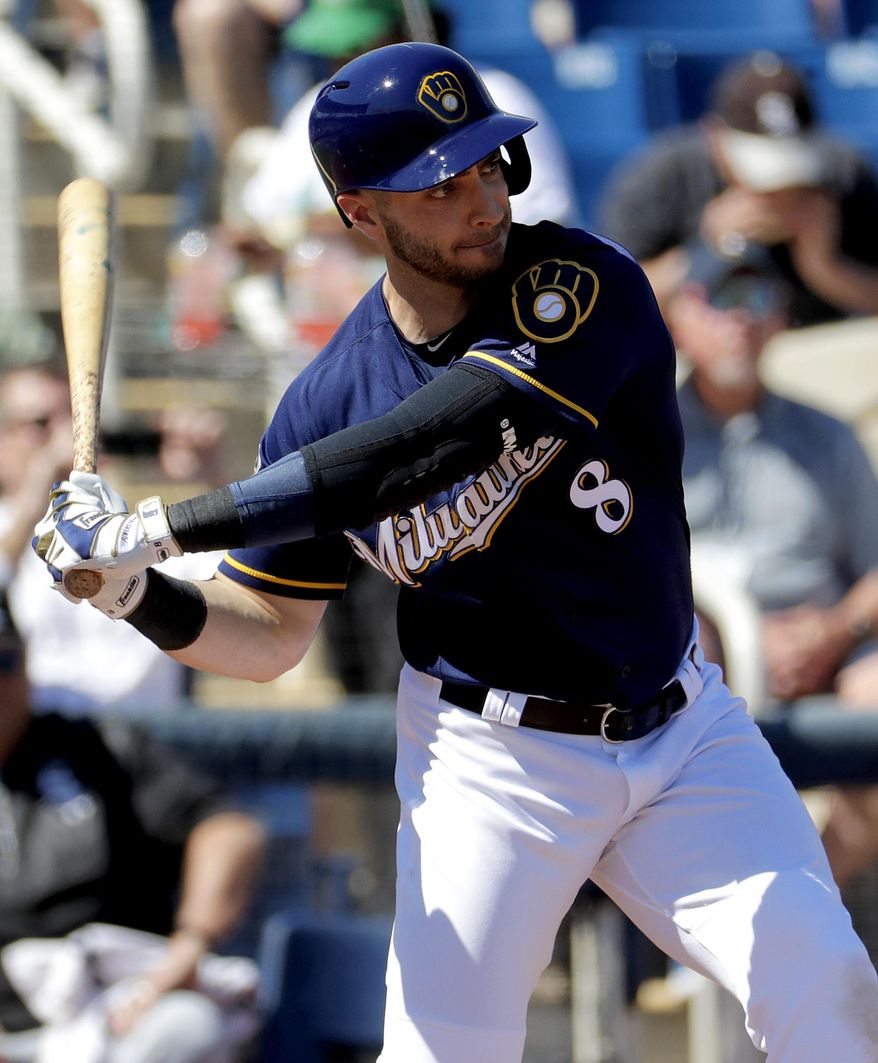 Milwaukee Brewers' Ryan Braun (8) hits during his first at bat of the season against the Chicago White Sox during the first inning of a spring training baseball game, Friday, March 10, 2017, in Phoenix. It was Braun's first spring training game of the season. (AP Photo/Matt York)