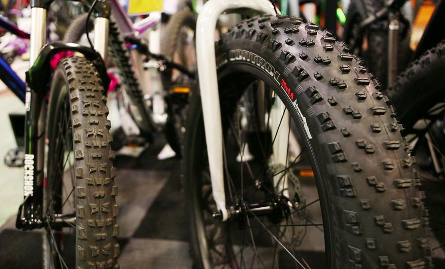 In this Thursday, Feb. 8, 2017 photo a fat tire bike, right, is seen next to a mountain bike at the Gorham Bike and Ski shop in Portland, Maine. Fat tires have been around for a decade, but they've come into the mainstream in the past five years. The trend is good news for people seeking to get outdoors year round - and for bicycle shops that are keeping busy during the slow winter months. (AP Photo/Robert F. Bukaty)